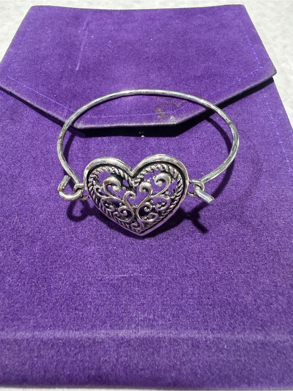 Silver colored bracelet heart bangle